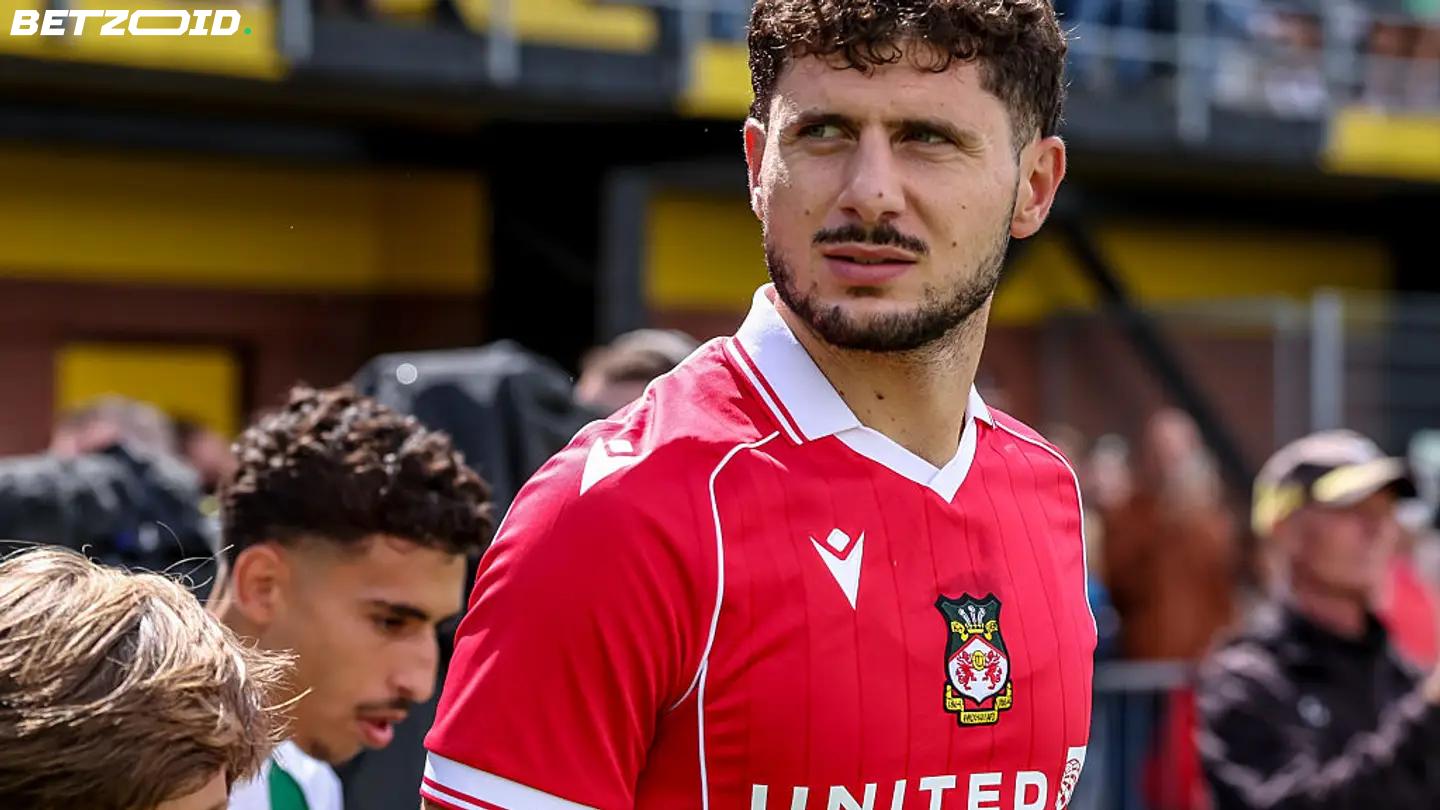 Cacace Determined to Fulfill Wrexham Ambitions Following Injury-Riddled First Season